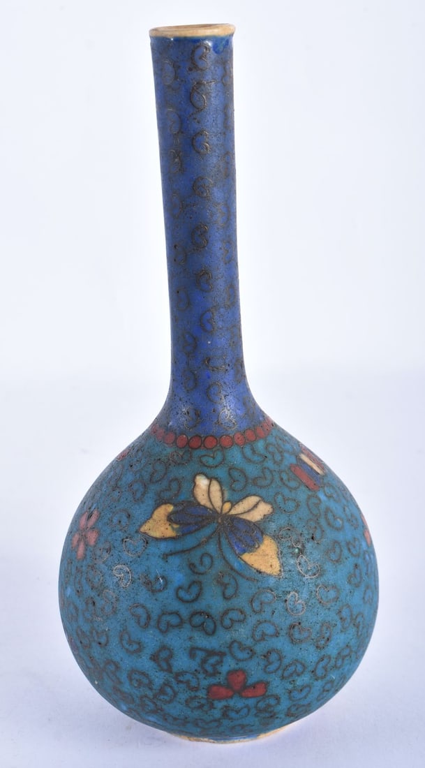 A 19TH CENTURY JAPANESE MEIJI PERIOD CLOISONNE OVERLAID PORCELAIN VASE decorated with birds and foli: A 19TH CENTURY JAPANESE MEIJI PERIOD CLOISONNE OVERLAID PORCELAIN VASE decorated with birds and foliage. 18.5 cm high.