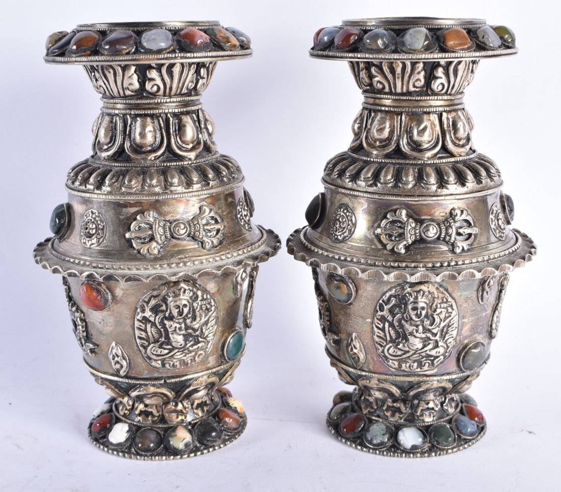 A PAIR OF TIBETAN WHITE METAL AND HARDSTONE VASES decorated with figures. 1758 grams. 18.5 cm high. (1 of 6)
