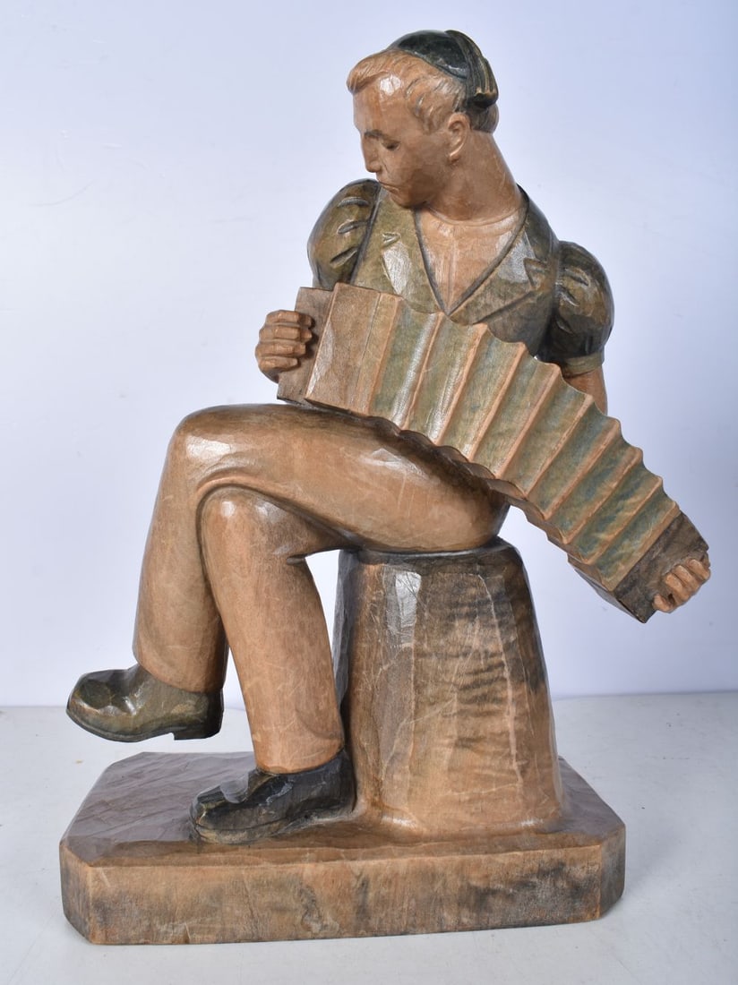 Hans Huggler Wyss carved wood accordion player 26cm.: Hans Huggler Wyss carved wood accordion player 26cm.