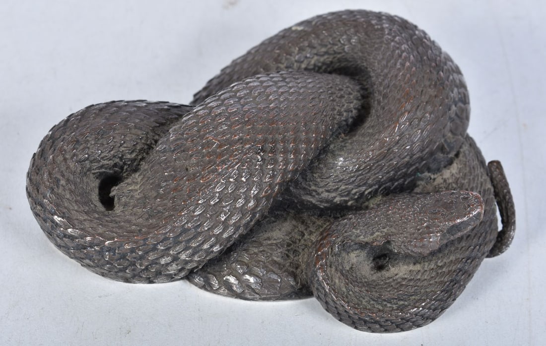 A silvered brass snake figurine. 11 cm wide. (1 of 3)