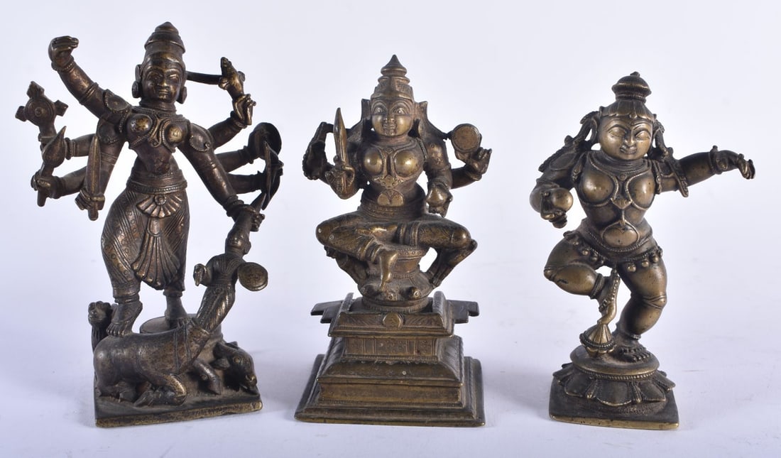 THREE 17TH/18TH CENTURY INDIAN BRONZE HINDU DEITIES including a multi armed figure pulling the head (1 of 7)