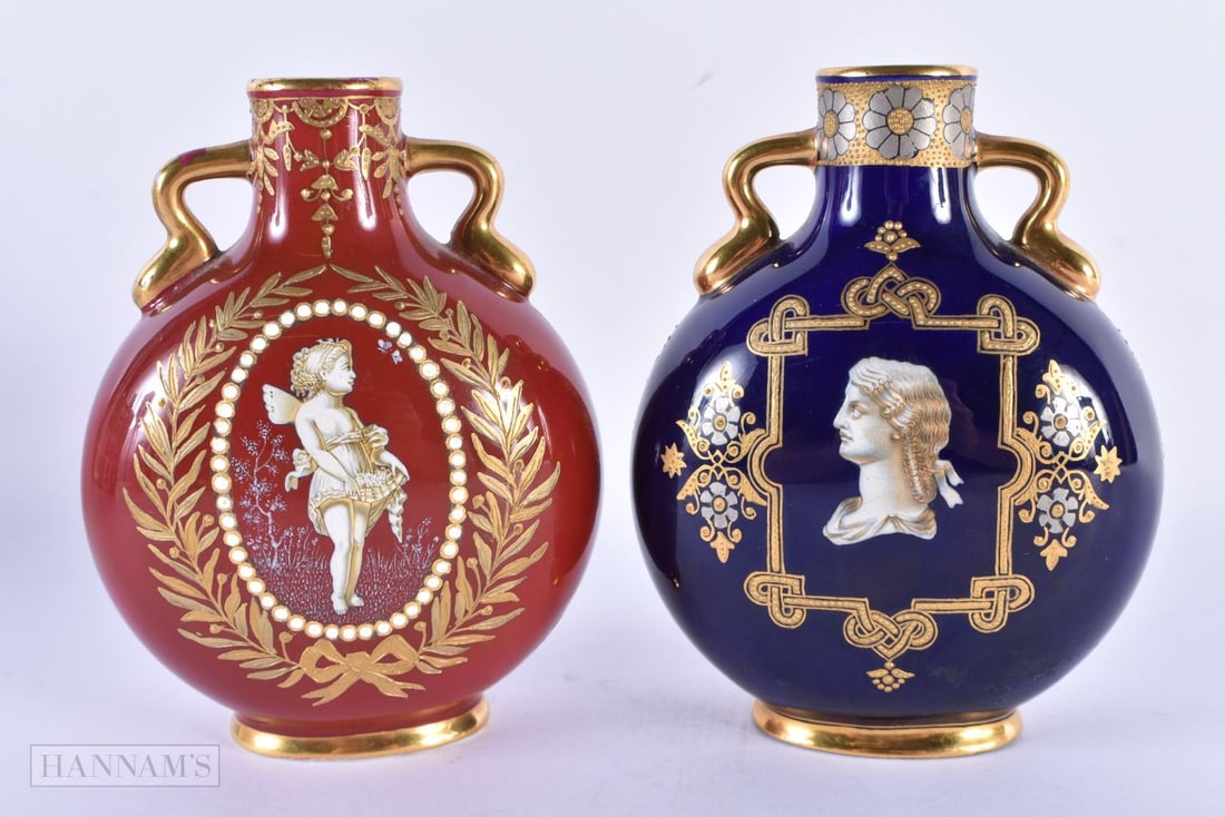 A FINE PAIR OF COALPORT TWIN HANDLED PORCELAIN JEWELLED PILGRIM FLASKS both enamelled in relief with: A FINE PAIR OF COALPORT TWIN HANDLED PORCELAIN JEWELLED PILGRIM FLASKS both enamelled in relief with classical figures. 13 cm x 9.5 cm. (2)