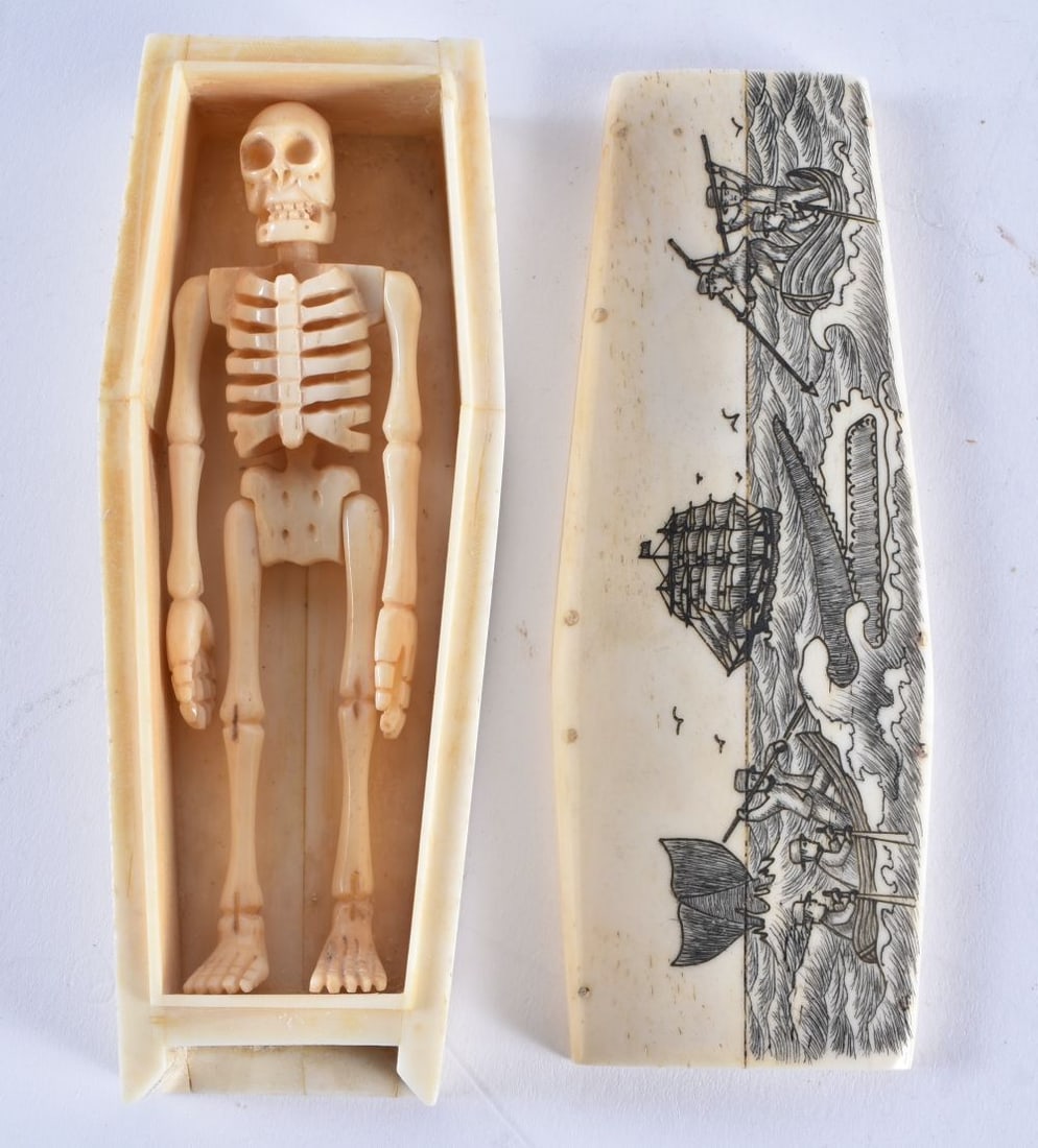 A CONTINENTAL CARVED BONE COFFIN. 143 grams. 11.5 cm x 4.5 cm.: A CONTINENTAL CARVED BONE COFFIN. 143 grams. 11.5 cm x 4.5 cm.
