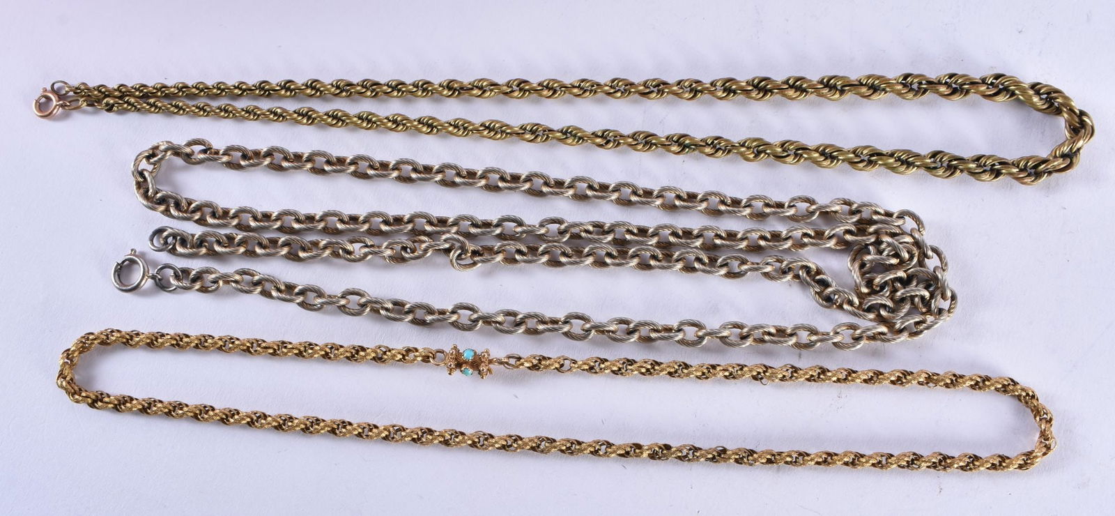 AN ANTIQUE YELLOW METAL AND TURQUOISE NECKLACE together with two others. (3) (1 of 6)