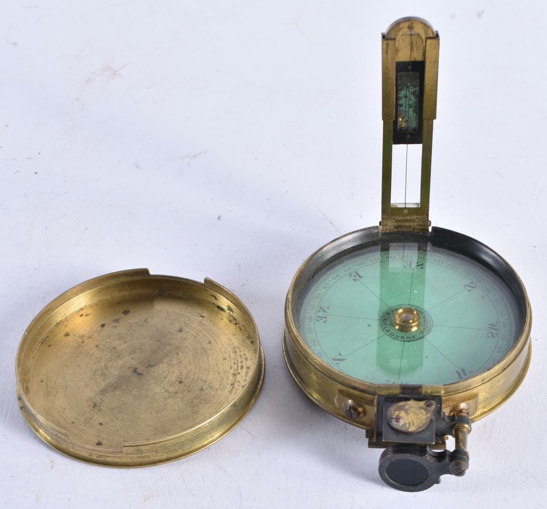 AN ANTIQUE BRASS CASED COMPASS. 7.25 cm x 2.5 cm. (1 of 3)