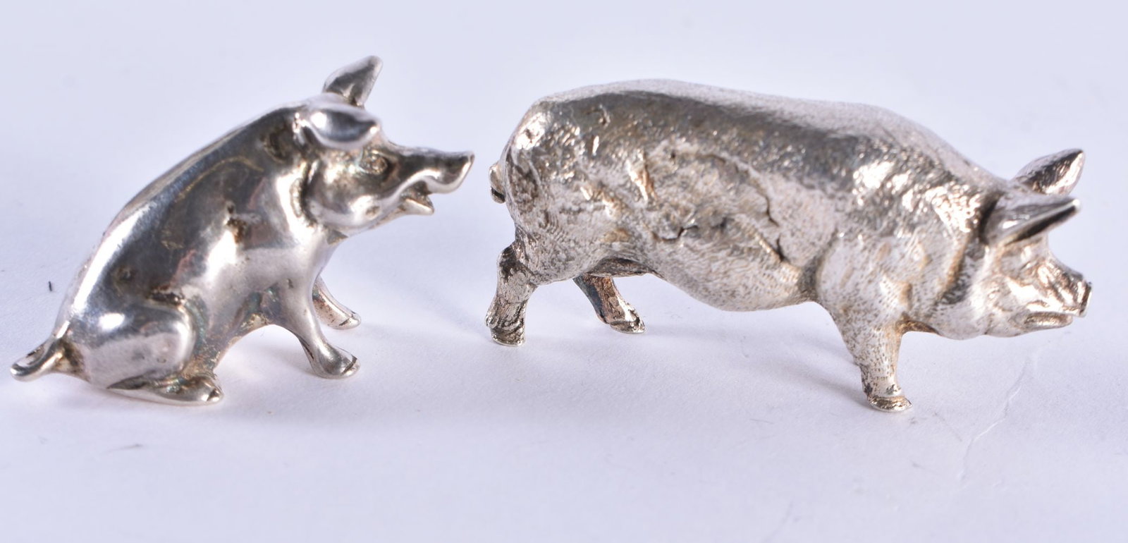 TWO SILVER PIGS. 51.4 grams. 5 cm x 2.5 cm. (2): TWO SILVER PIGS. 51.4 grams. 5 cm x 2.5 cm. (2)
