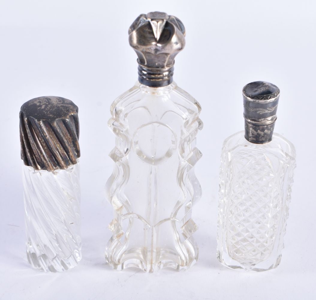 THREE ANTIQUE FRENCH SILVER MOUNTED CUT GLASS SCENT BOTTLES. 210.6 grams overall. Largest 12 cm high (1 of 5)