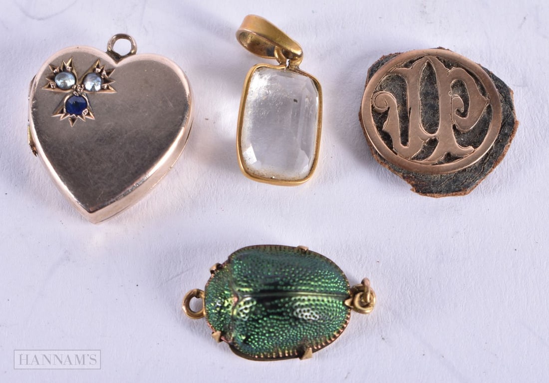 YELLOW METAL LOCKETS. 6.2 grams. Largest 2 cm x 1.75 cm. (4): YELLOW METAL LOCKETS. 6.2 grams. Largest 2 cm x 1.75 cm. (4)