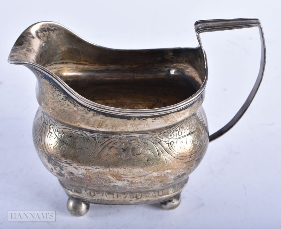 AN ANTIQUE SILVER CREAM JUG. London 1810. 140 grams. 12.75 cm x 10.25 cm. (1 of 4)