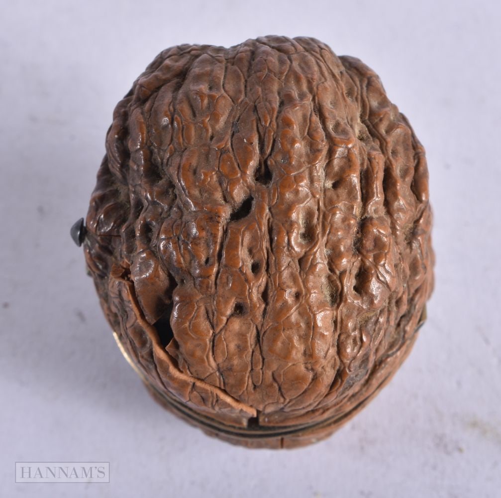 AN ANTIQUE NUT ETUI. 30 grams. 4.5 cm x 4.25 cm. (1 of 3)