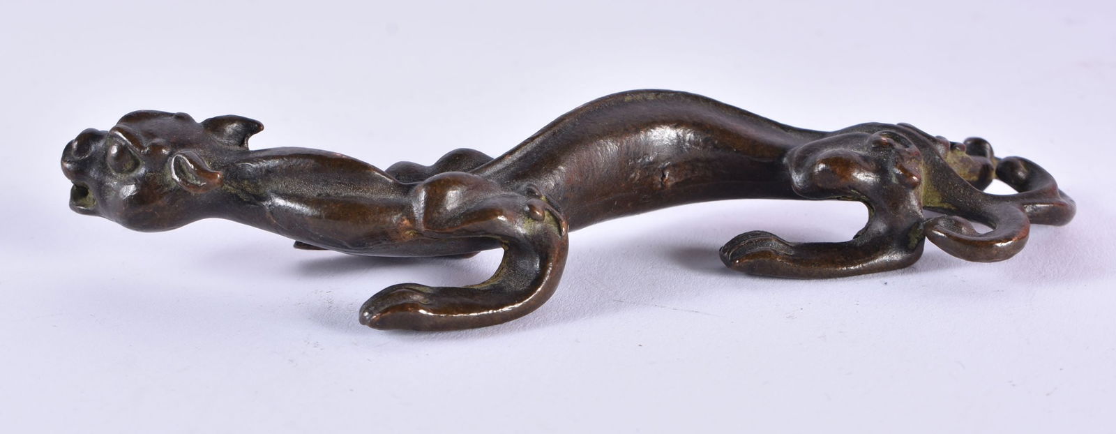 A CHINESE BRONZE STYLISED BEAST SCROLL WEIGHT. 14 cm wide. (1 of 4)