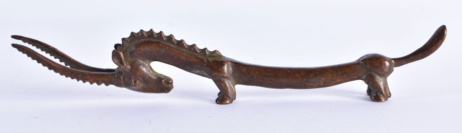 A JAPANESE BRONZE ANTELOPE SCROLL WEIGHT. 120 grams. 19.25 cm long. (1 of 5)
