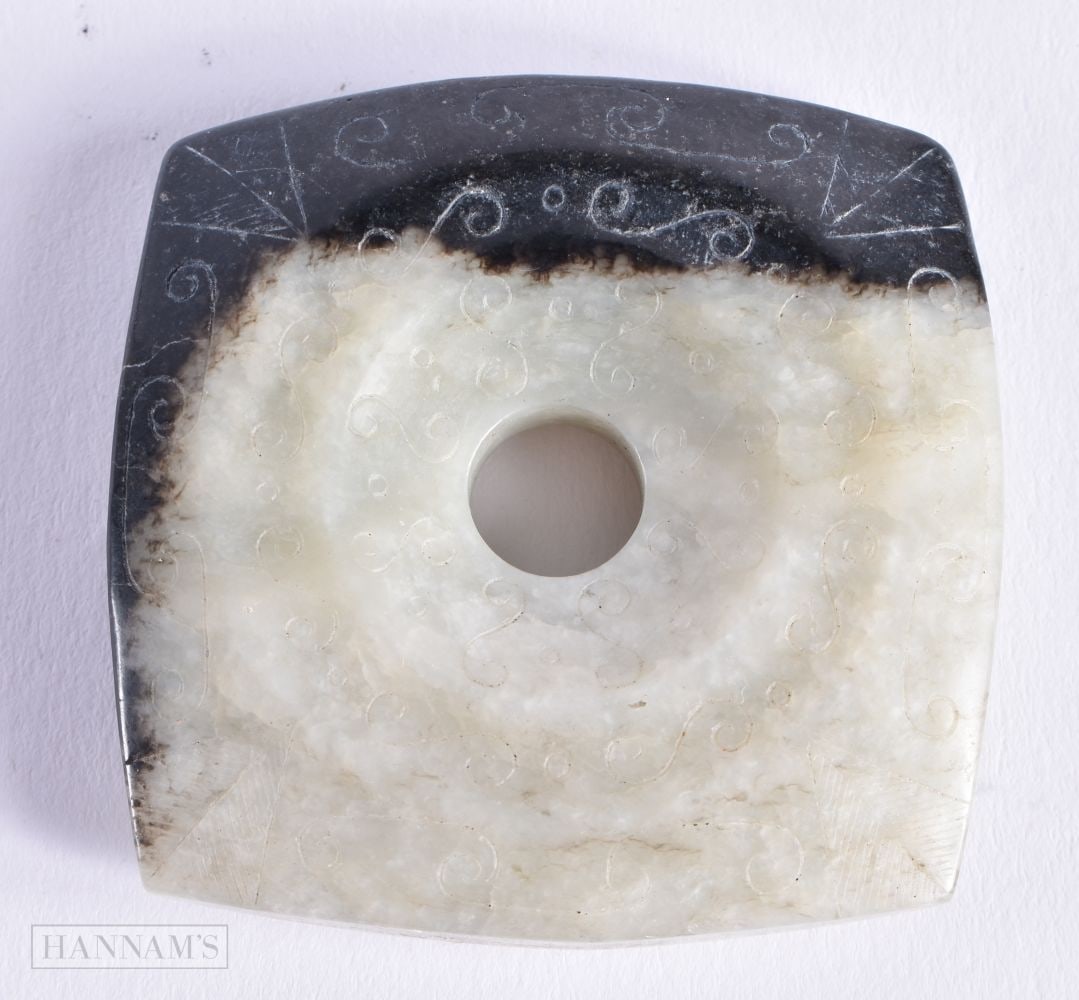 A CHINESE MUTTON JADE DISC. 5.25 cm square.: A CHINESE MUTTON JADE DISC. 5.25 cm square.