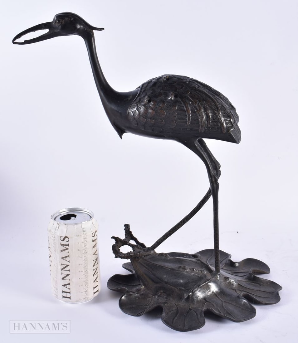 A 19TH CENTURY JAPANESE MEIJI PERIOD BRONZE CENSER AND COVER formed as a bird. 38 cm high.: A 19TH CENTURY JAPANESE MEIJI PERIOD BRONZE CENSER AND COVER formed as a bird. 38 cm high.