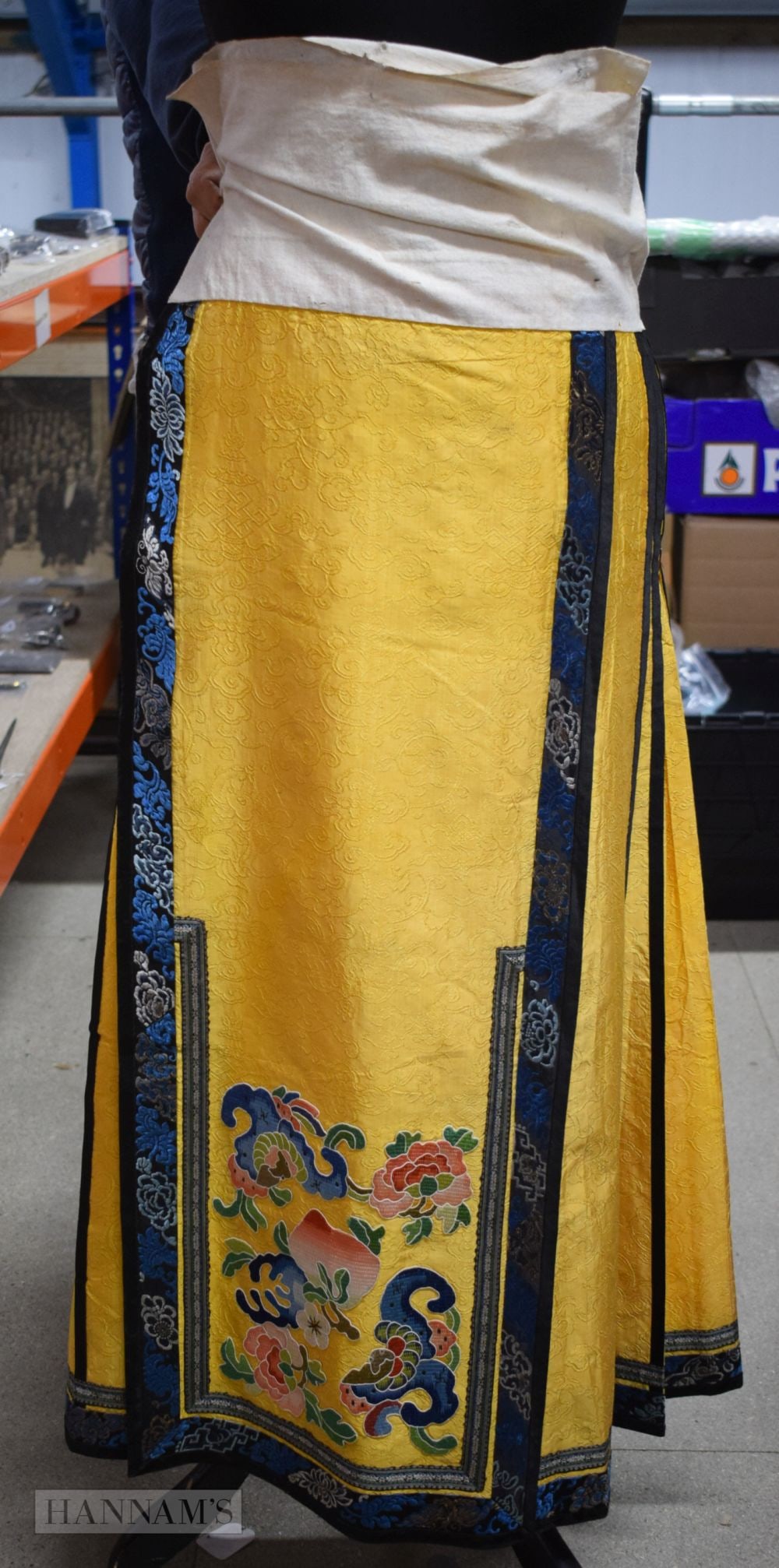 A LATE 19TH CENTURY CHINESE YELLOW SILK EMBROIDERED SKIRT with blue floral rim. 96 cm x 115 cm (1 of 10)