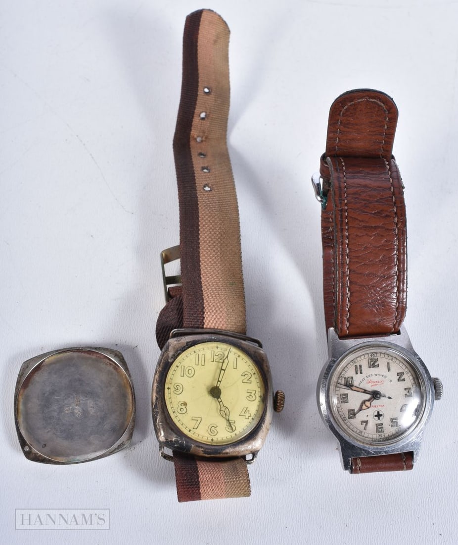 A Silver cased and inscribed gentleman's wristwatch dated 1929 together with a Military Prima West E (1 of 5)