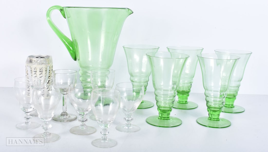 A large vintage Uranium glass jug with 5 matching glasses and a quantity of wine/sherry glasses 24cm (1 of 5)