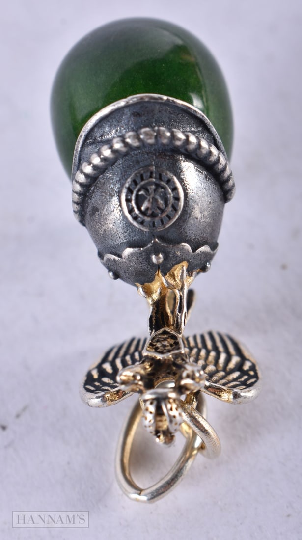 A Continental Silver and Jade Eagle Helmet Mounted Jade Pendant. Stamped 84. 4.7cm x 2.3cm x 1.5cm, (1 of 3)