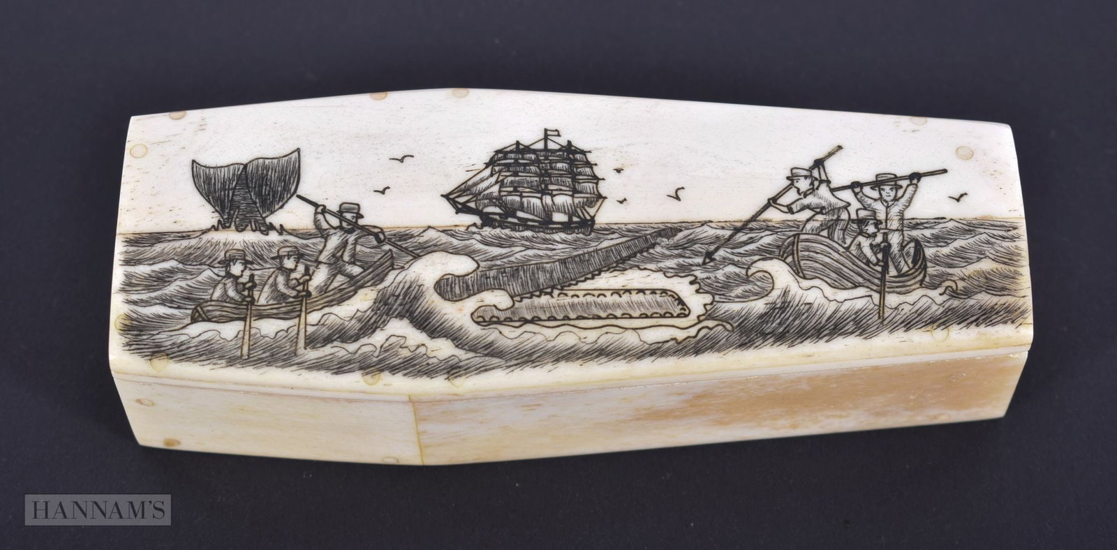 A CARVED BONE SCRIMSHAW COFFIN. 136 grams. 11.5 cm x 4.5 cm.: A CARVED BONE SCRIMSHAW COFFIN. 136 grams. 11.5 cm x 4.5 cm.