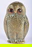 AN UNUSUAL ANTIQUE BRONZE OWL GLASS EYED SPILL HOLDER. 10 cm x 6 cm.