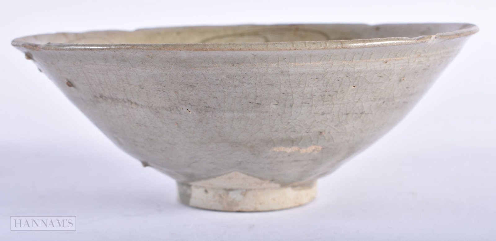 A CHINESE MING DYNASTY STONEWARE CELADON INCISED BOWL. 16 cm wide.: A CHINESE MING DYNASTY STONEWARE CELADON INCISED BOWL. 16 cm wide.