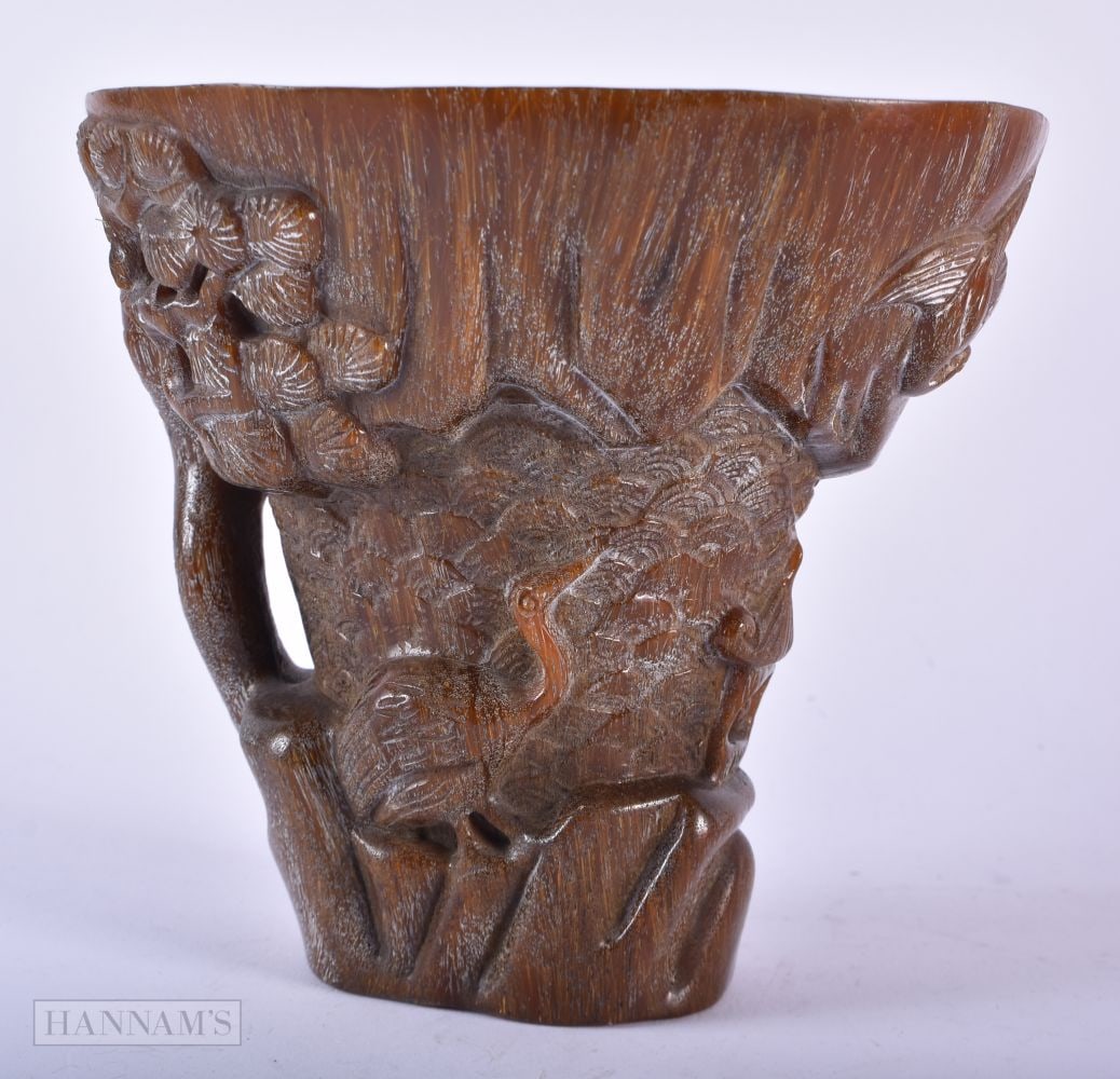 A CHINESE CARVED BUFFALO HORN TYPE LIBATION CUP. 803 grams. 14cm x 14cm. (1 of 4)