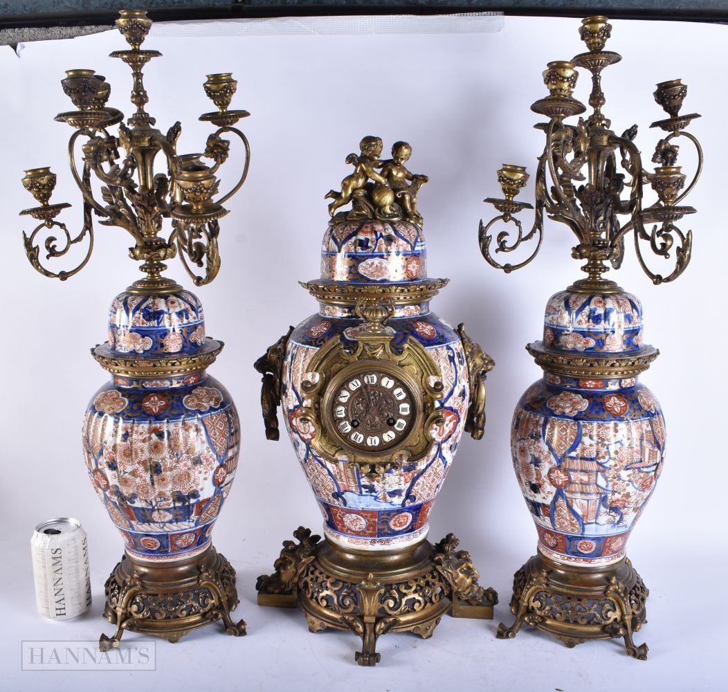 A VERY LARGE 19TH CENTURY JAPANESE MEIJI PERIOD IMARI BRONZE CLOCK GARNITURE. Largest 54 cm high.: A VERY LARGE 19TH CENTURY JAPANESE MEIJI PERIOD IMARI BRONZE CLOCK GARNITURE. Largest 54 cm high.