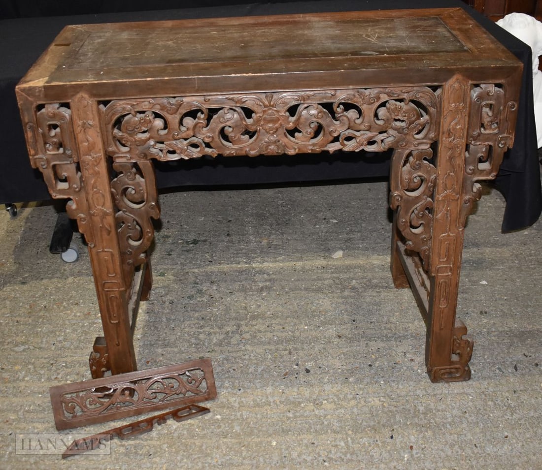 A 20th Century Chinese hardwood altar table with carved friezes to the side and front 90 x 108 x 50c: A 20th Century Chinese hardwood altar table with carved friezes to the side and front 90 x 108 x 50cm
