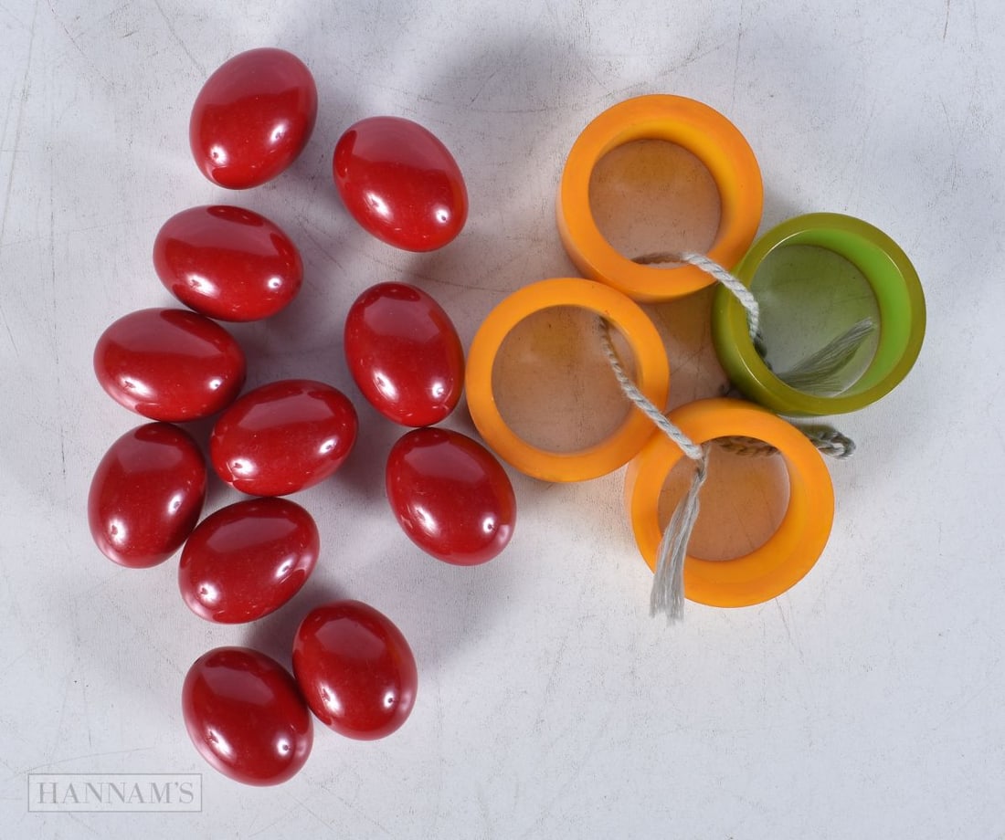 A collection of 1930's Bakelite napkin rings together with a collection of Cherry amber beads larges (1 of 2)
