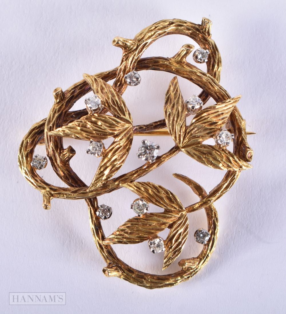 A 1960S 18CT GOLD AND DIAMOND BROOCH. London 1967. Maker EJLd. 12 grams. 4 cm x 3.5 cm. (1 of 5)