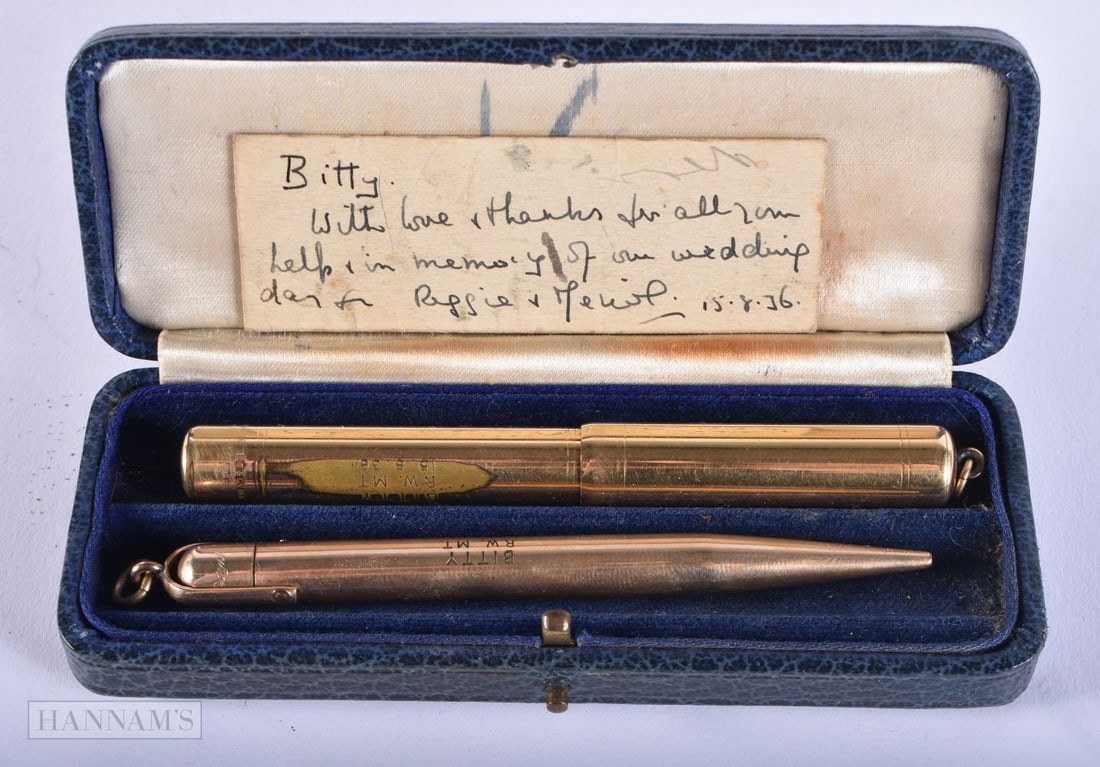 TWO VINTAGE YELLOW METAL PENS. 29.2 grams. Largest 10.5 cm long. (2): TWO VINTAGE YELLOW METAL PENS. 29.2 grams. Largest 10.5 cm long. (2)