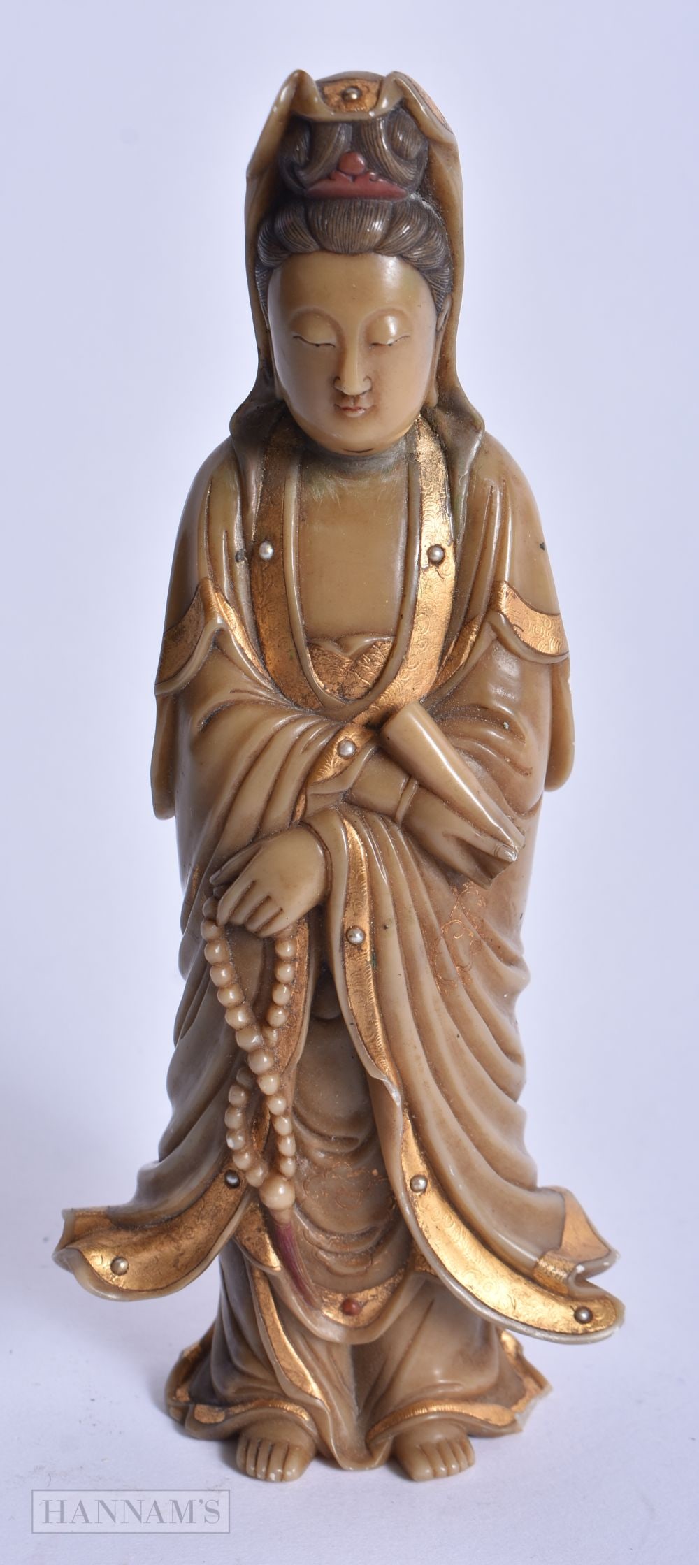 A CHINESE QING DYNASTY GILDED SOAPSTONE FIGURE OF GUANYIN. 16 cm high.: A CHINESE QING DYNASTY GILDED SOAPSTONE FIGURE OF GUANYIN. 16 cm high.