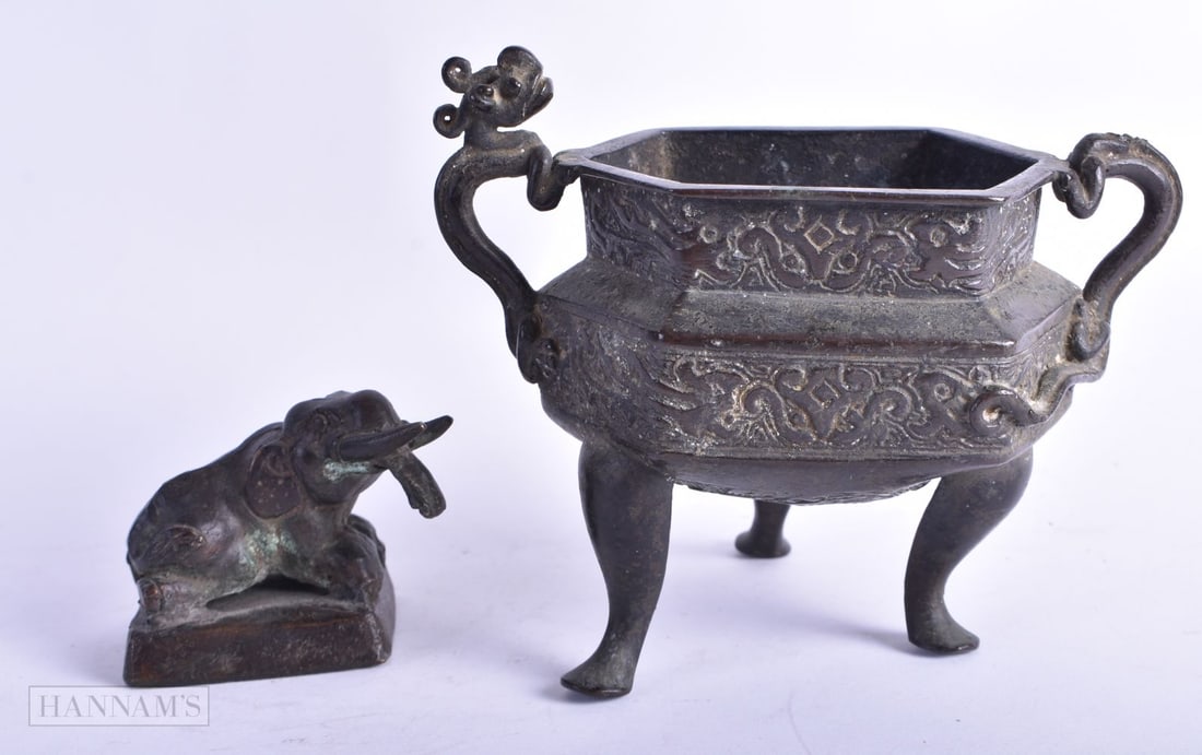 A CHINESE QING DYNASTY BRONZE CENSER together with a bronze elephant seal. Largest 12 cm wide. (2) (1 of 5)