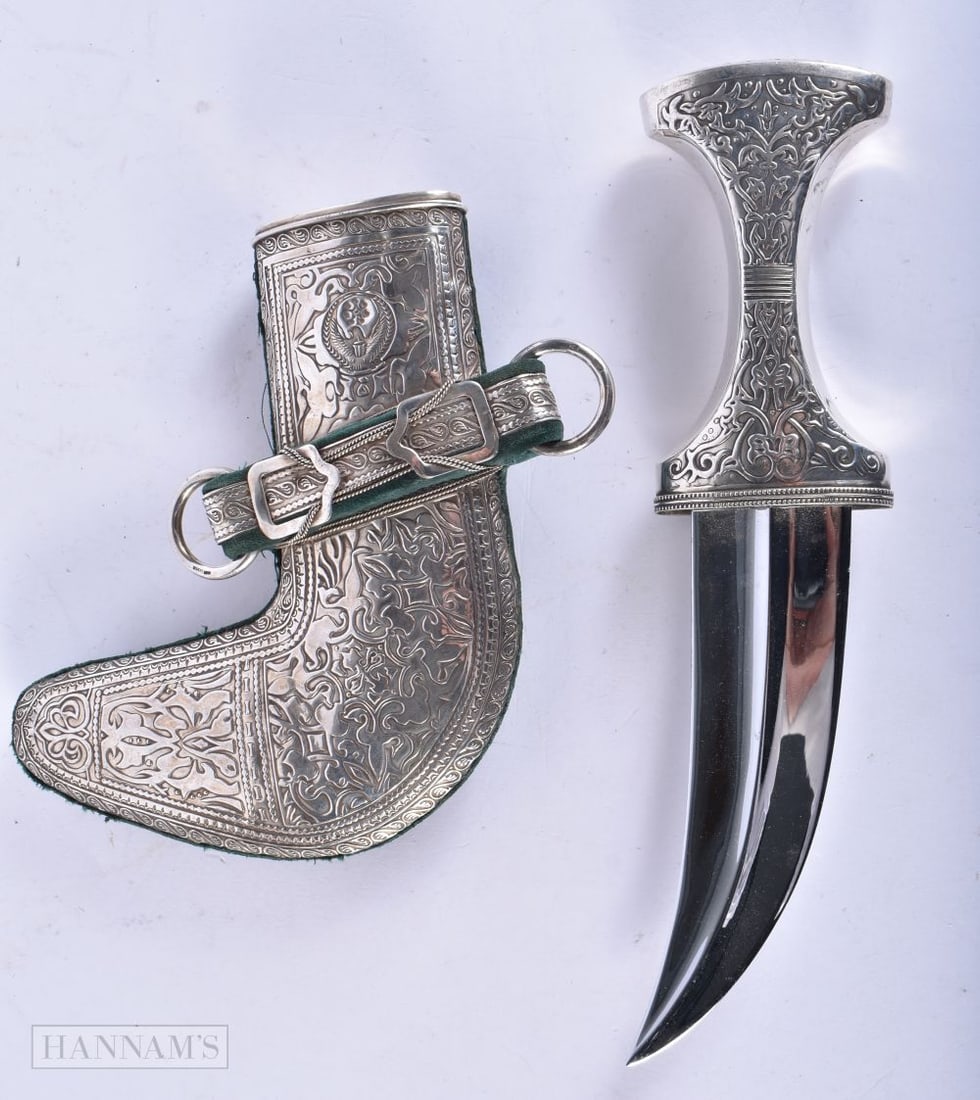 A LARGE MIDDLE EASTERN SILVER OVERLAID JAMBIYA DAGGER. 28cm x 14 cm. (1 of 9)