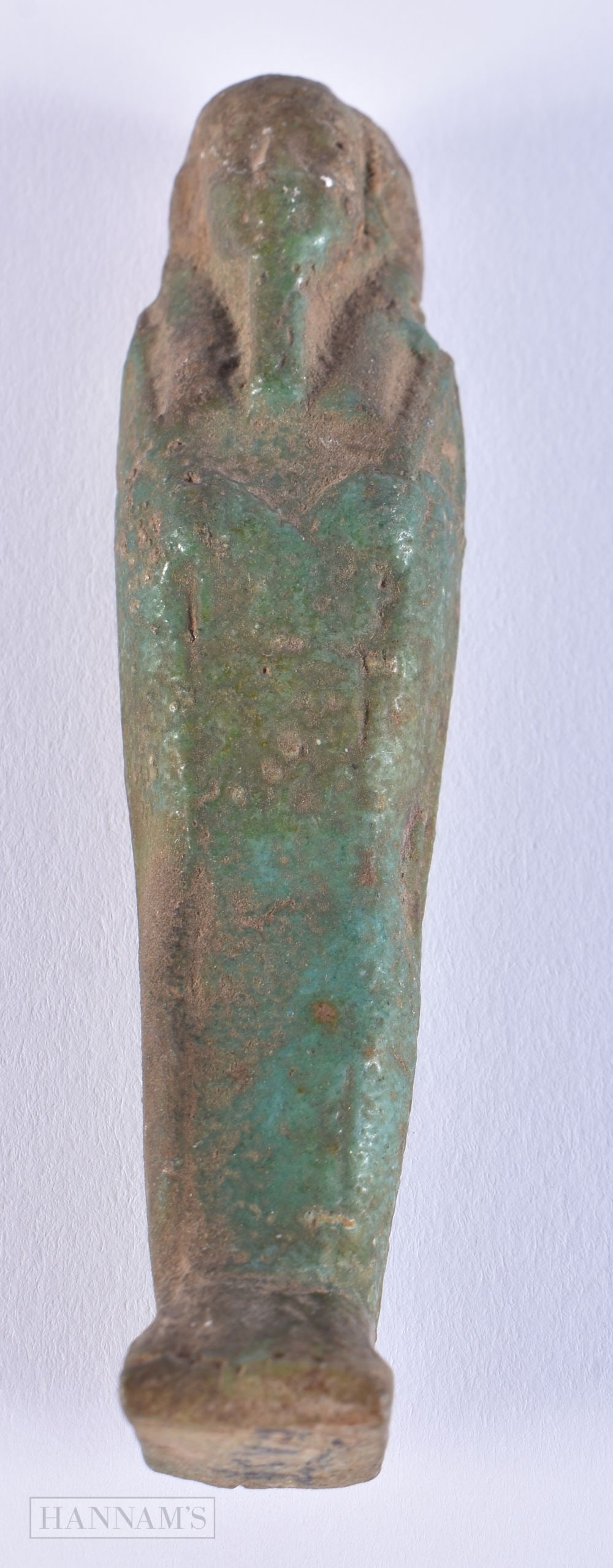 AN EARLY EGYPTIAN ANTIQUITY TURQUOISE GLAZED SHABTI. 10.5 cm high. (1 of 3)