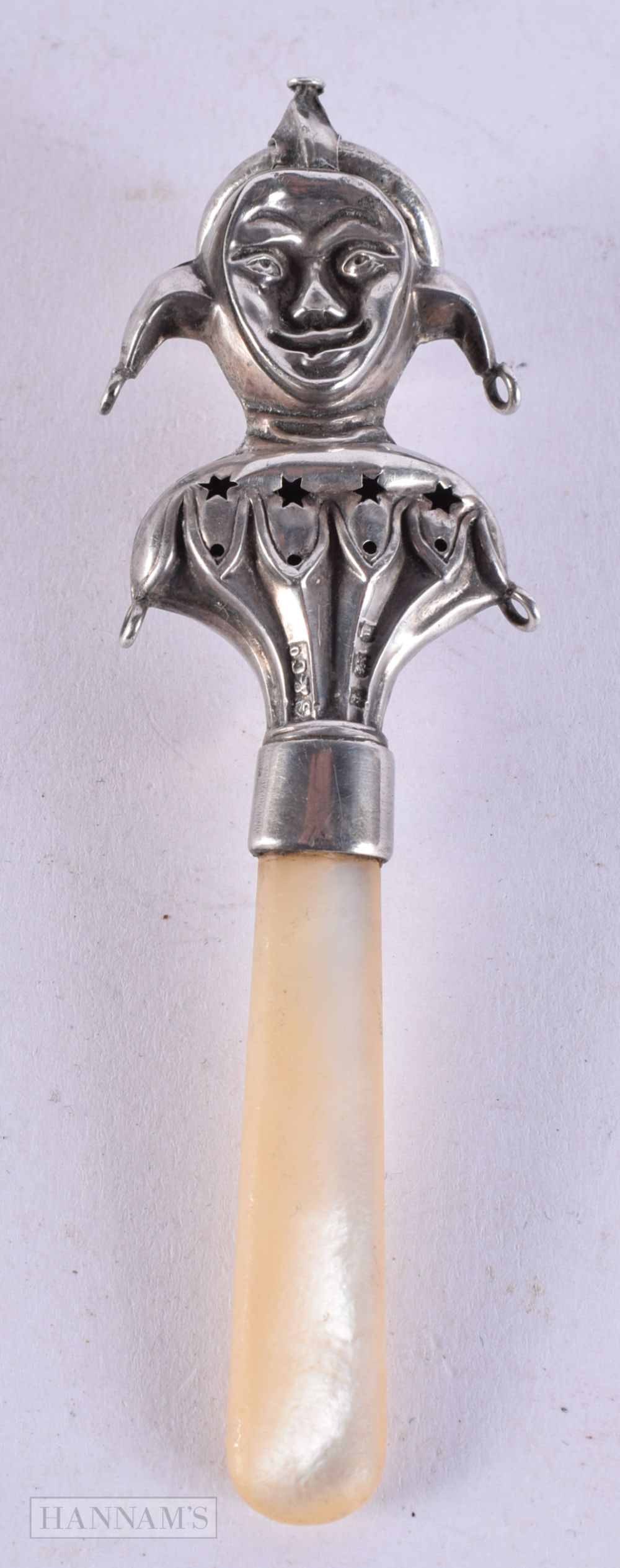 AN ANTIQUE ENGLISH SILVER AND MOTHER OF PEARL JESTER BABIES RATTLE. 11.5 cm long.: AN ANTIQUE ENGLISH SILVER AND MOTHER OF PEARL JESTER BABIES RATTLE. 11.5 cm long.