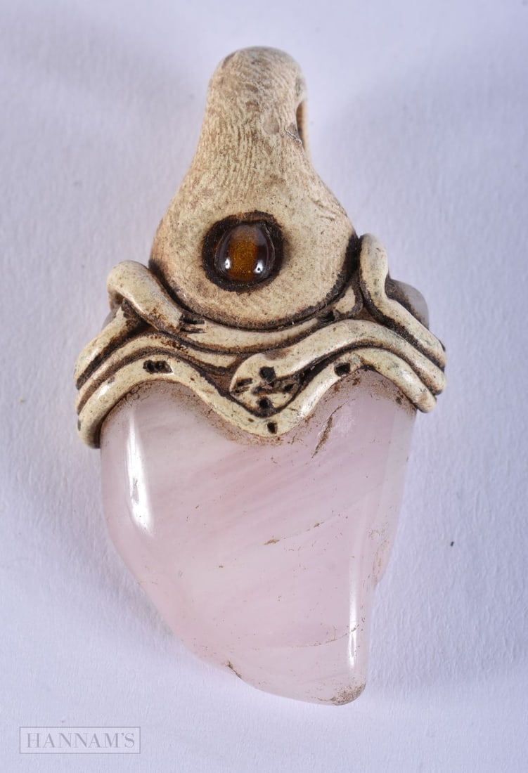 A TRIBAL STONE MOUNTED ROSE QUARTZ PENDANT. 18 grams. 4.75 cm x 2.75 cm. (1 of 2)