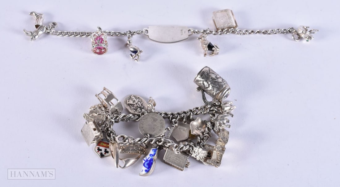 SILVER CHARM BRACELETS (2) 88.4 grams. 18 cm long.: SILVER CHARM BRACELETS (2) 88.4 grams. 18 cm long.