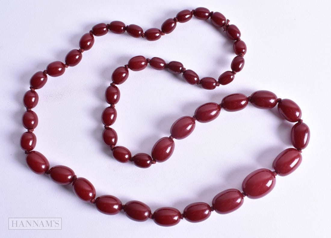 A BEADED NECKLACE. 98 grams. 88 cm long, largest bead 2.75 cm x 1.5 cm. (1 of 3)