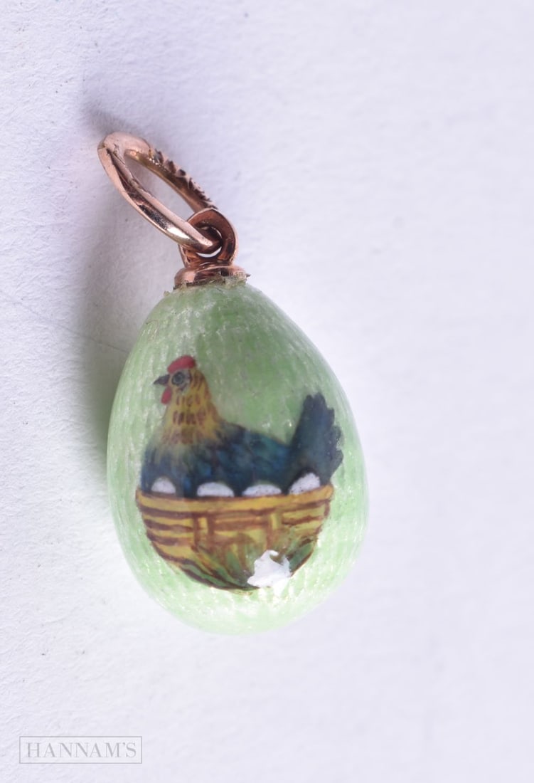 An Enamel Egg Pendant with a 14 Carat Gold Mount. Stamped 56. 2.5cm x 1.2 cm, weight 3.2g: An Enamel Egg Pendant with a 14 Carat Gold Mount. Stamped 56. 2.5cm x 1.2 cm, weight 3.2g
