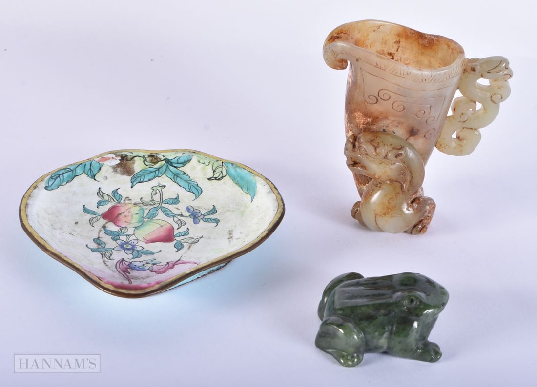 A 19TH CENTURY CHINESE CARVED GREEN JADE FROG together with a jade rhyton and a canton enamel dish. (1 of 5)