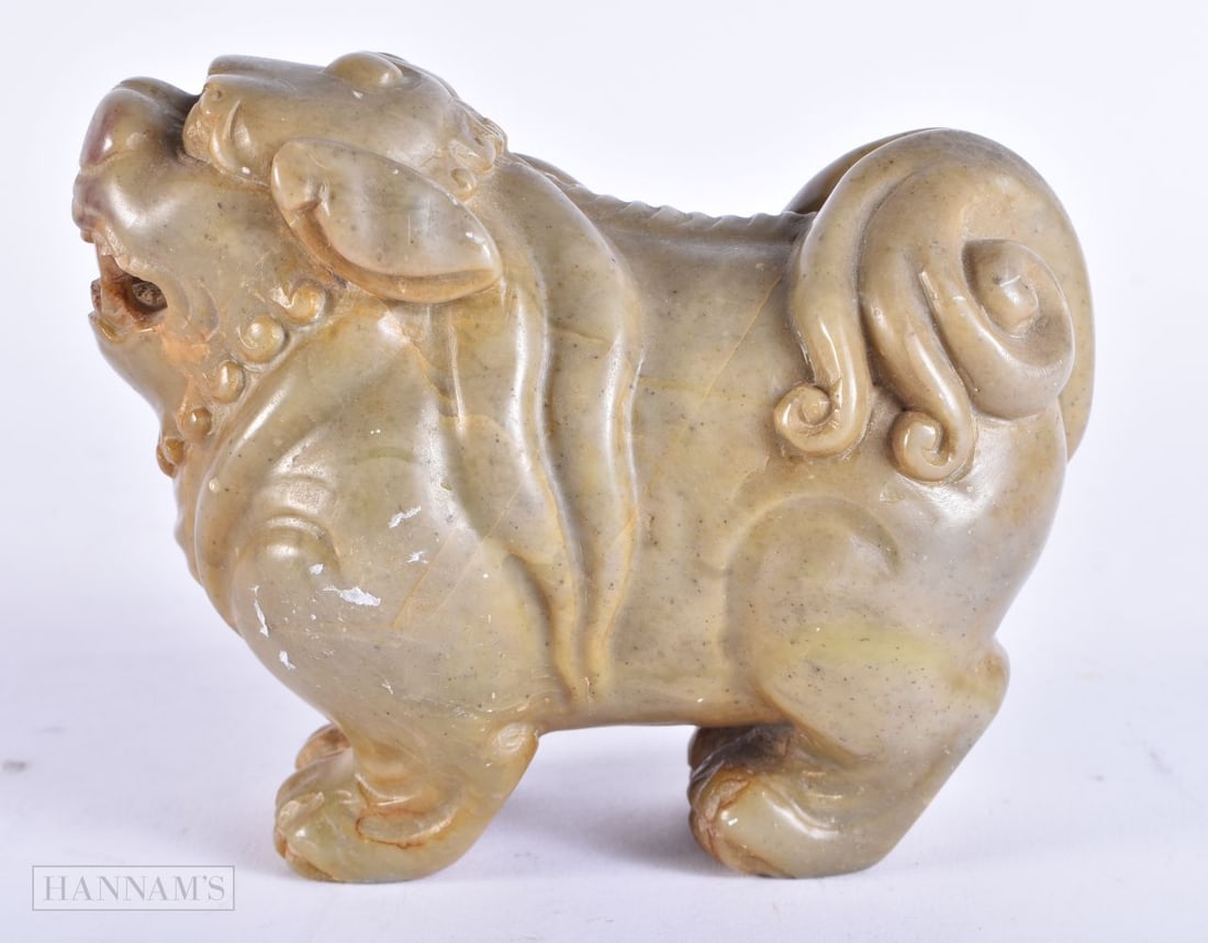 A 19TH CENTURY CHINESE CARVED SOAPSTONE FIGURE OF A BUDDHIST LION Late Qing. 13 cm x 10 cm.: A 19TH CENTURY CHINESE CARVED SOAPSTONE FIGURE OF A BUDDHIST LION Late Qing. 13 cm x 10 cm.