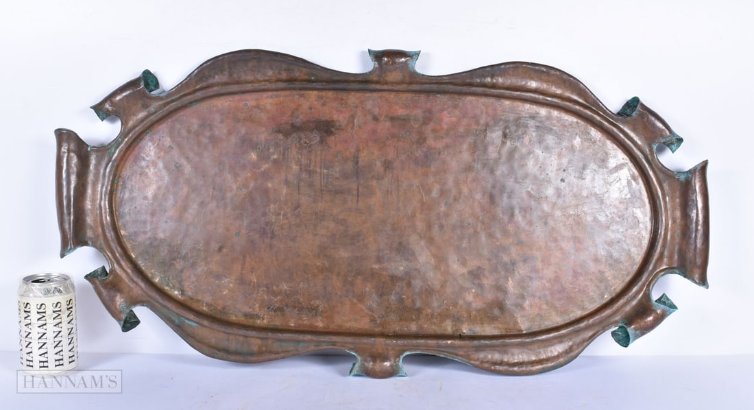 An unusual Art Nouveau large copper tray with scrolling decoration to the edge 80 x 40 cm . (1 of 3)