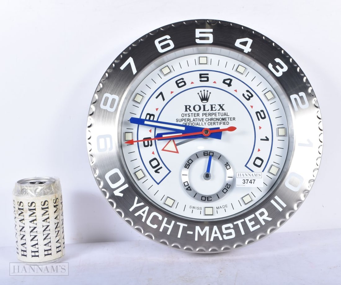 A contemporary Rolex Dealership style clock 34cm: A contemporary Rolex Dealership style clock 34cm