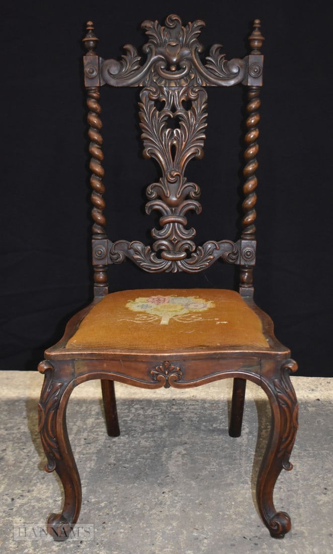 A VICTORIAN WALNUT CHAIR with carved leaf crest and splat. 70 cm x 20 cm. (1 of 3)