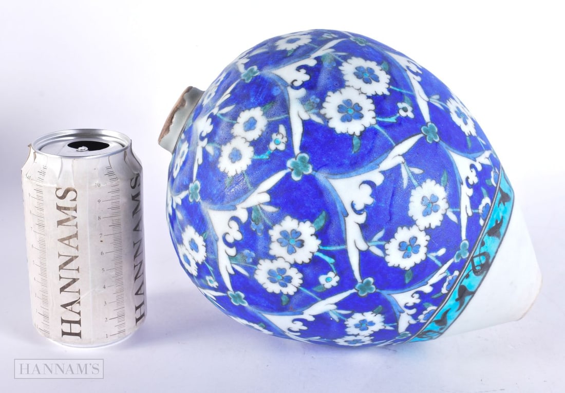AN OTTOMAN TURKISH IZNIK HANGING POTTERY BALL. 24 cm x 14 cm.: AN OTTOMAN TURKISH IZNIK HANGING POTTERY BALL. 24 cm x 14 cm.