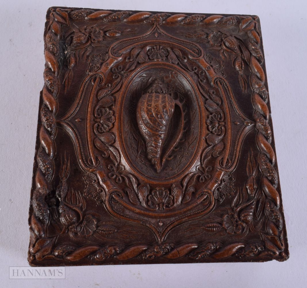 A 19TH CENTURY DAGUERREOTYPE PHOTOGRAPH the case decorated with shells and entwined foliage. 9.5 cm (1 of 3)
