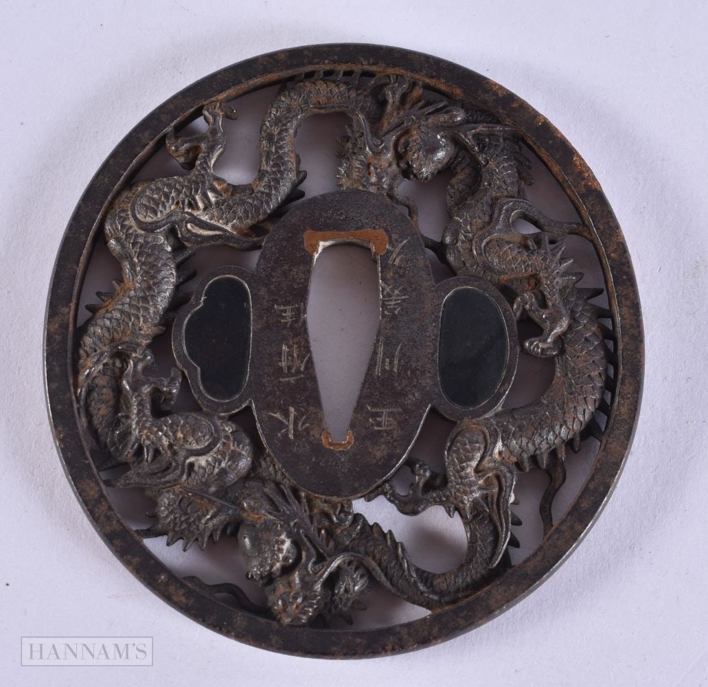 A 19TH CENTURY JAPANESE MEIJI PERIOD IRON TSUBA decorated with dragons. 8 cm x 7.5 cm. (1 of 3)