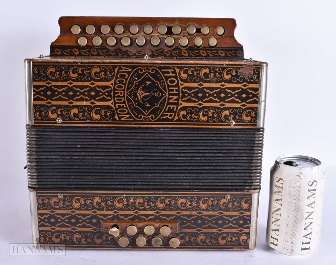 A LARGE CARVED WOOD HOHNER ACCORDION. 32 cm x 24 cm.: A LARGE CARVED WOOD HOHNER ACCORDION. 32 cm x 24 cm.