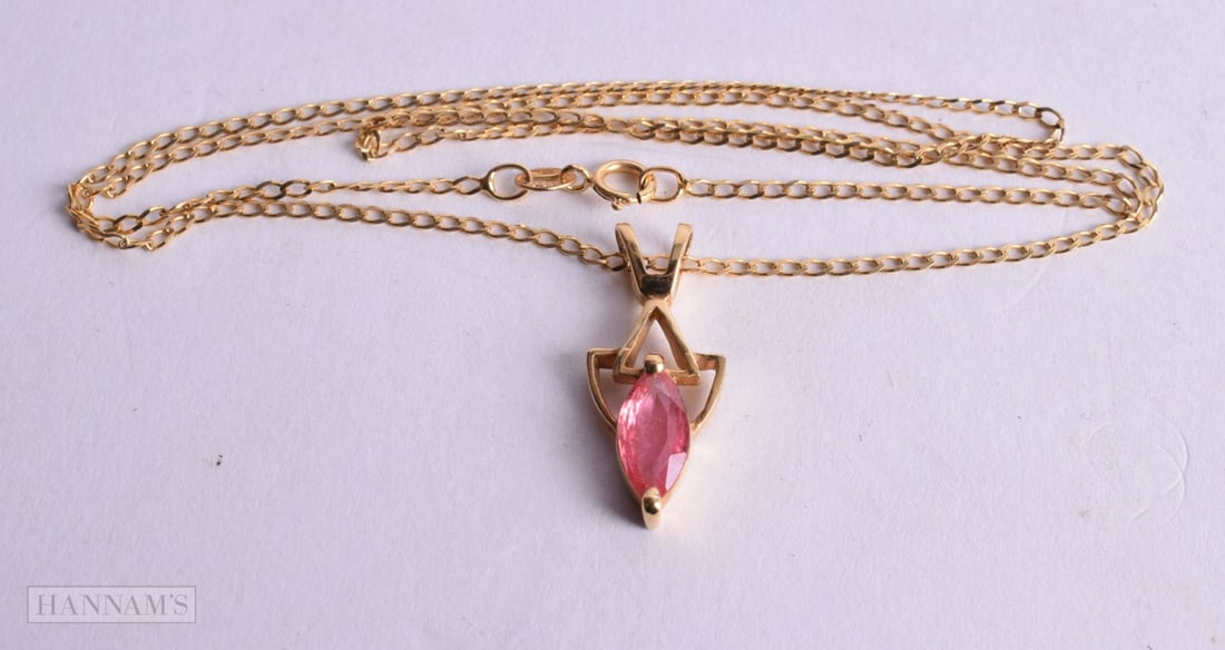 18ct gold marquise cut enhanced padparadscha sapphire pendant with a 9ct gold curb link chain (3.1g) (1 of 2)